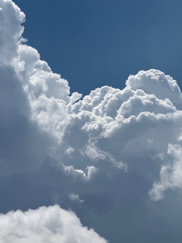 Big summer clouds over wet Mikhaylovsk streets, morning of June 26
