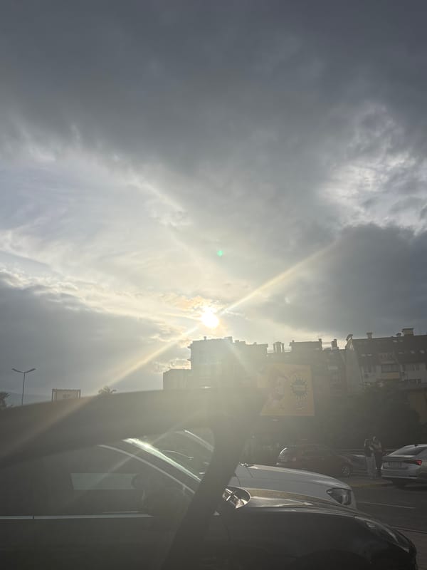 Urban street scene documented under sunny skies May 7