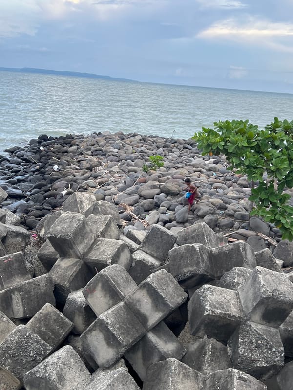 Children play along Davao City seawall during morning hours