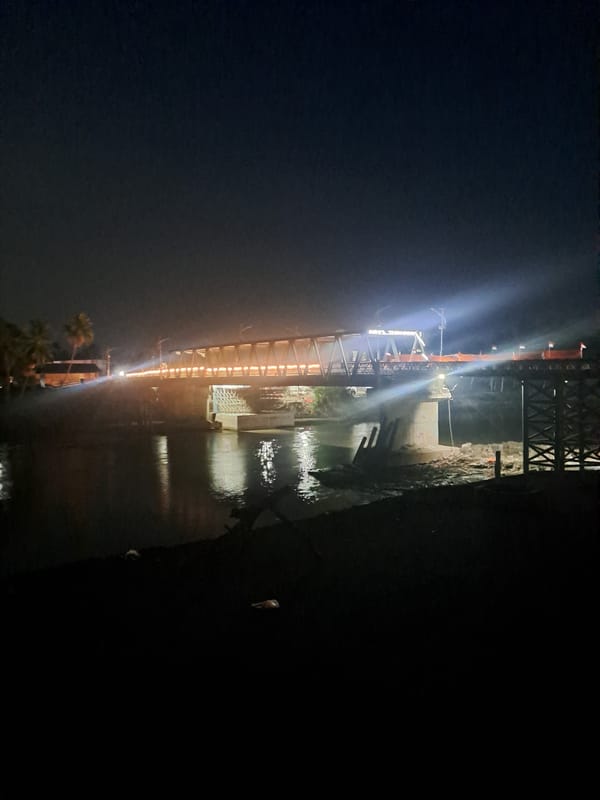 Illuminated bridge observed at night in Tingkeummanyang, Indonesia