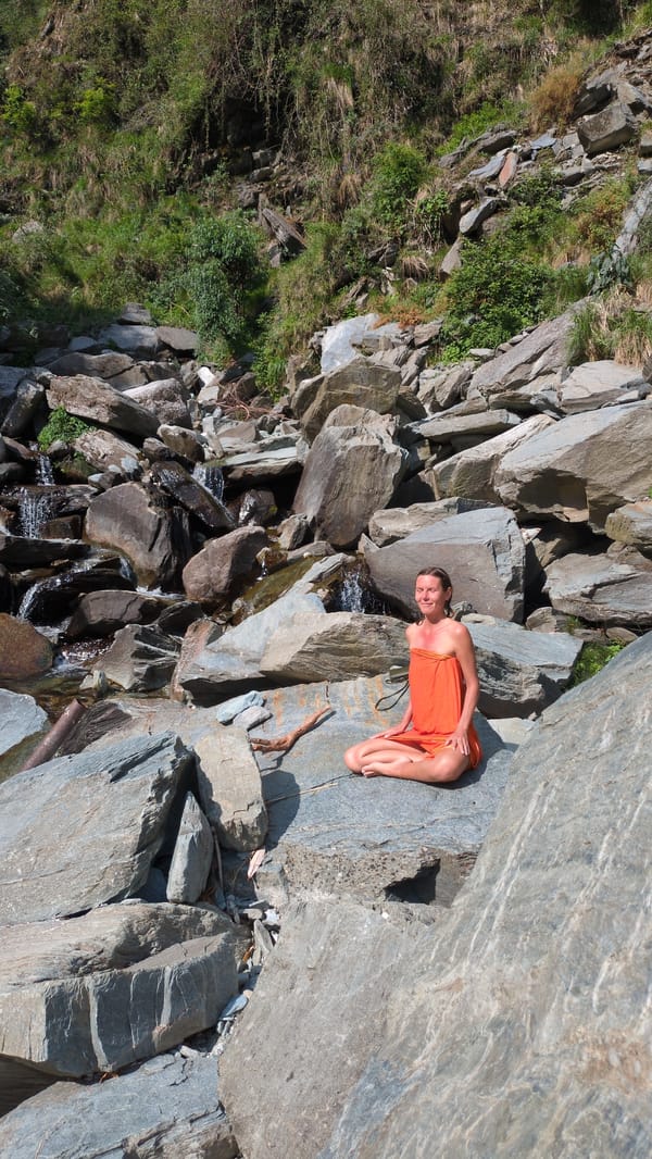 Visitors enjoy peaceful morning at Bhagsu waterfall, India