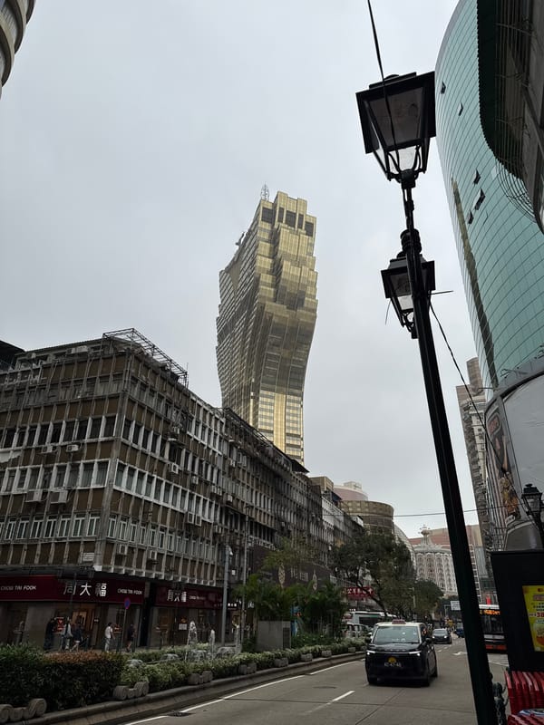 Morning taxi traffic observed on Macau street