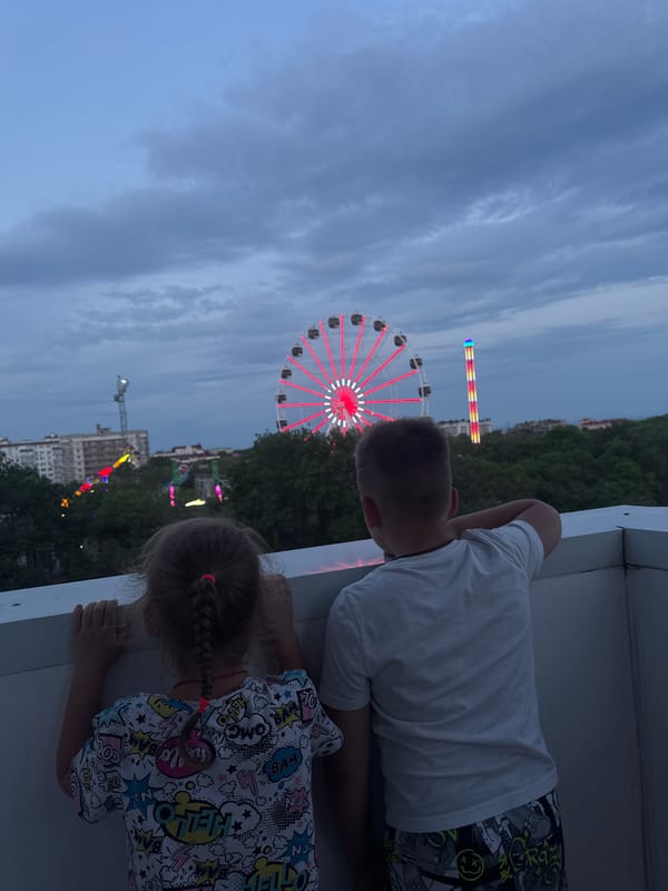 Family enjoys evening at illuminated amusement park in Yevpatoriya