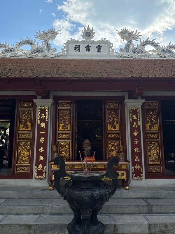 Tourist documents traditional architecture during morning walk in Hà Nội