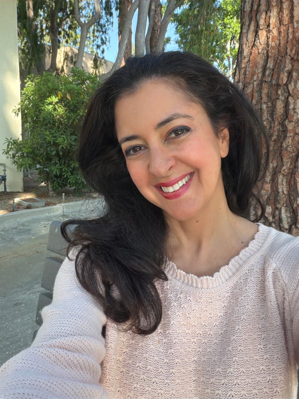 Woman records greeting message outdoors in Los Angeles