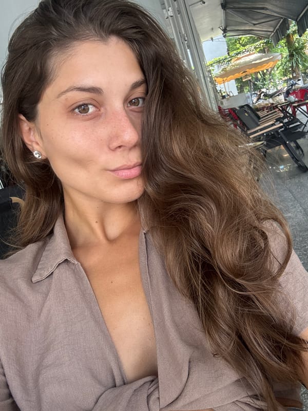 Woman documents friendly street cat during early morning in Đà Nẵng