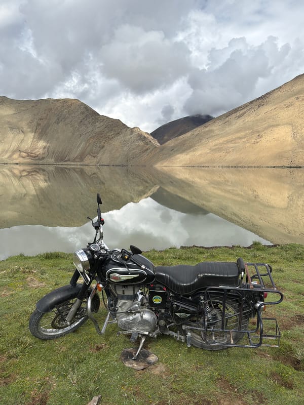 Lakeside camp stop: bikes, badminton, and mountain wildlife