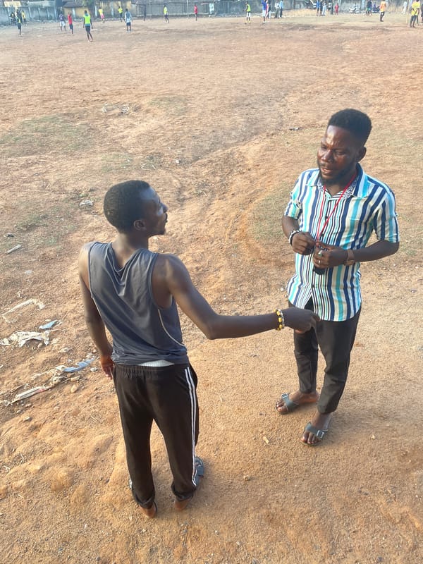 Sports training session documented on dirt field in Akwanga