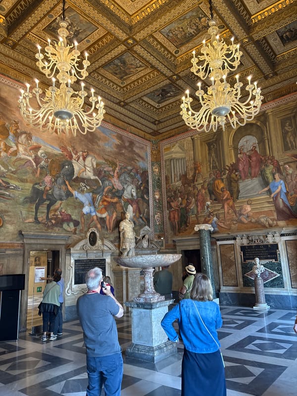 Tourist visits ornate Capitoline Museums hall in Rome