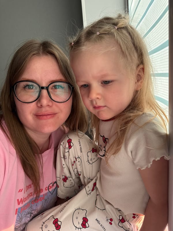 Mother and child in Hello Kitty pajamas at home
