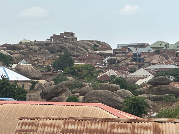 School marching band practices amid Jos Nigeria's boulder landscape