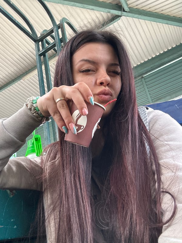Woman enjoys coffee at Bulgarian produce market in Sliven