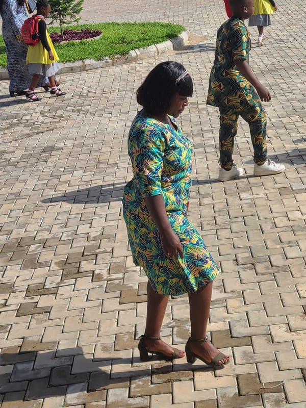 Community gathering at Kingdom Heritage Model School in Diye