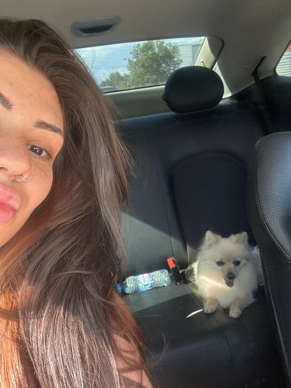 Woman photographed making playful faces in car in Sofia