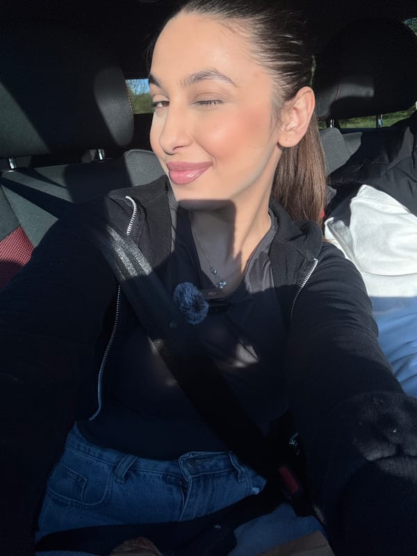 Woman takes selfie while seated in car in Mönchengladbach