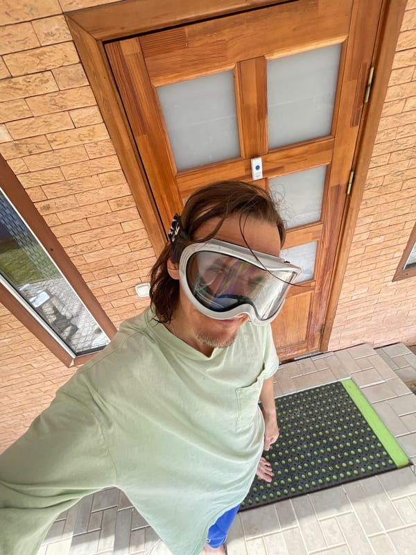 Man in goggles spotted indoors near window in Russia