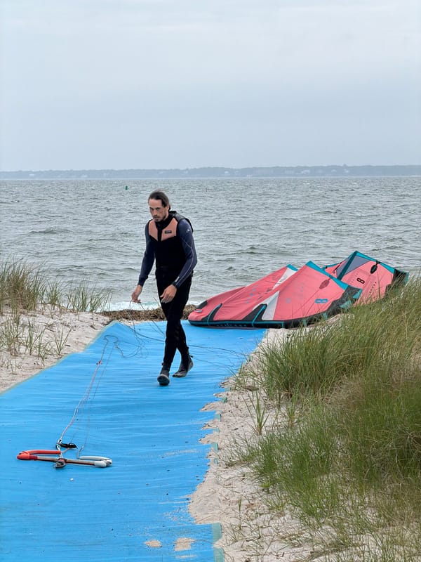 Kitesurfing session on a cloudy Southampton beach afternoon
