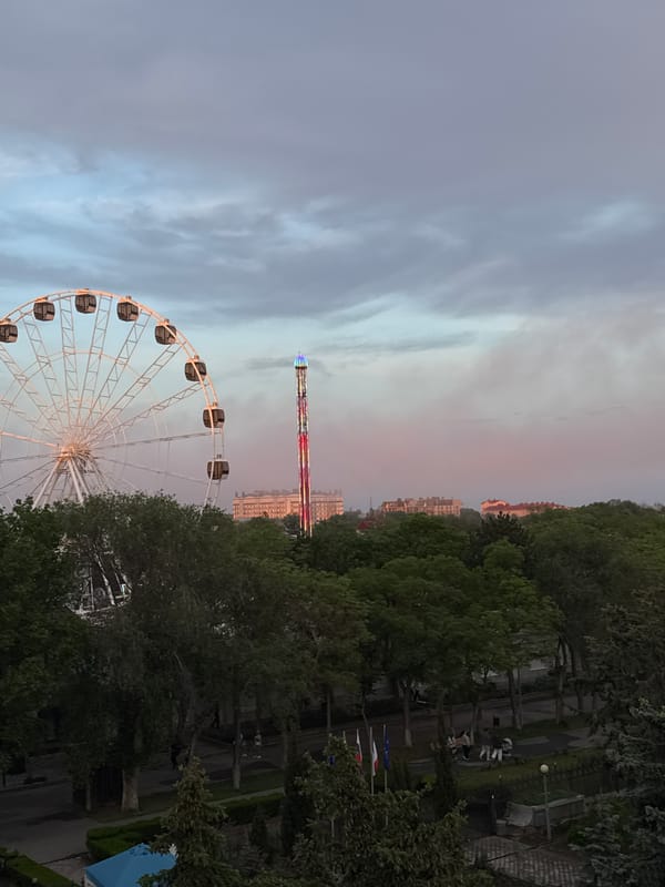 Evening view captured of Yevpatoriya's Ferris wheel and tower
