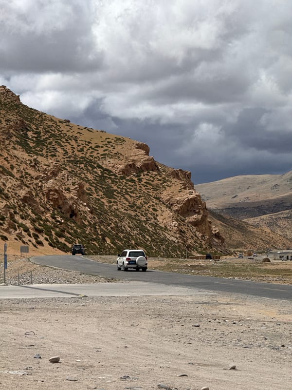 Gas station and mountain road documented in Kela Township