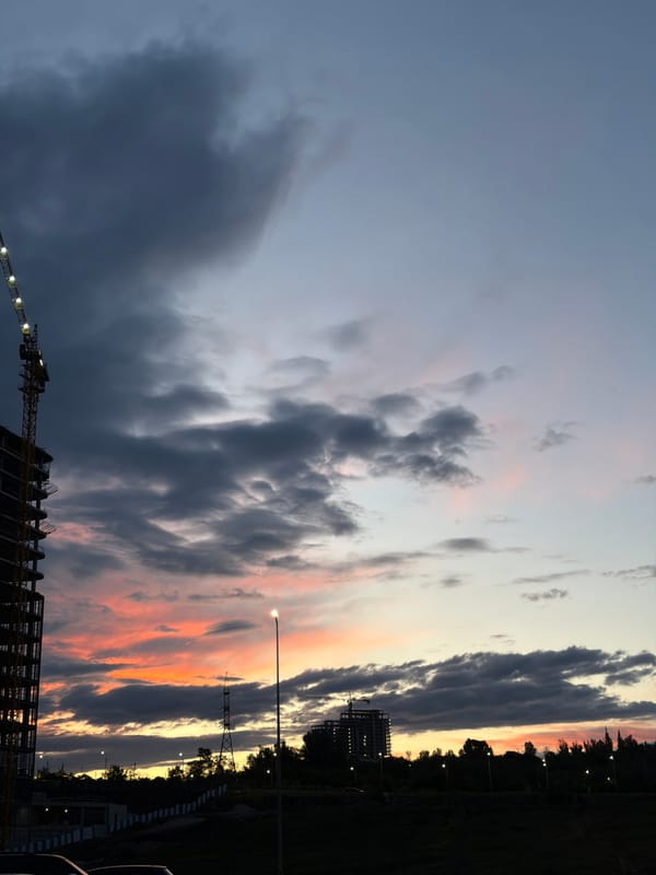 Construction continues at dusk in Yerevan high-rise project