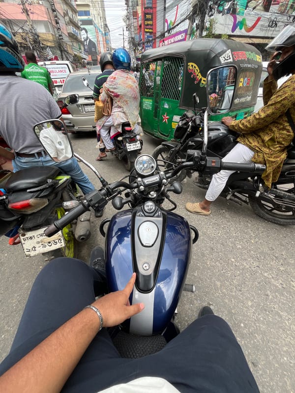Motorcycle rider caught in morning traffic jam in Dhaka