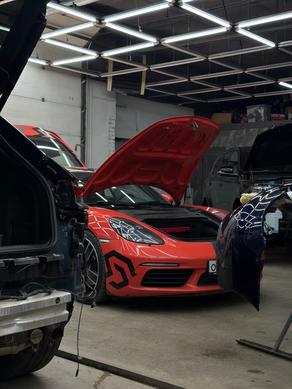 Porsche Macan getting detailed at a Krasnoyarsk auto shop