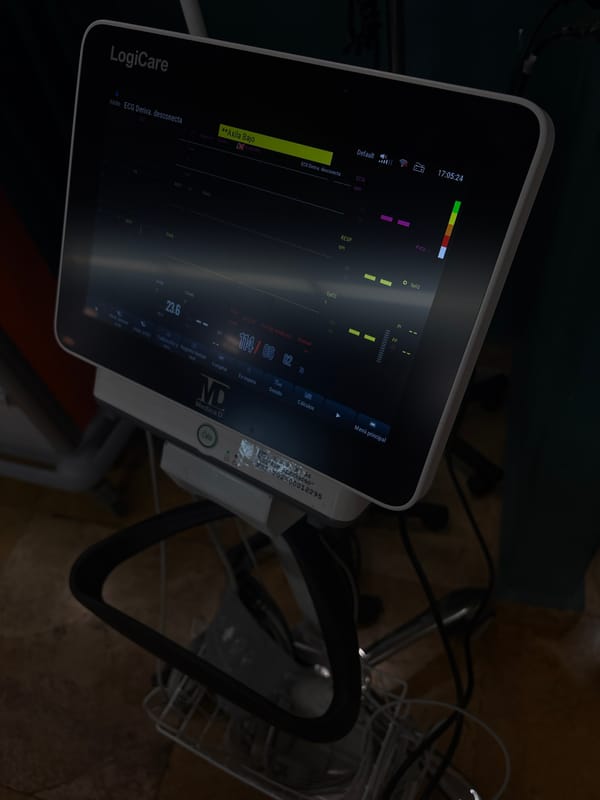 Medical monitor displays patient vitals in darkened Puebla facility