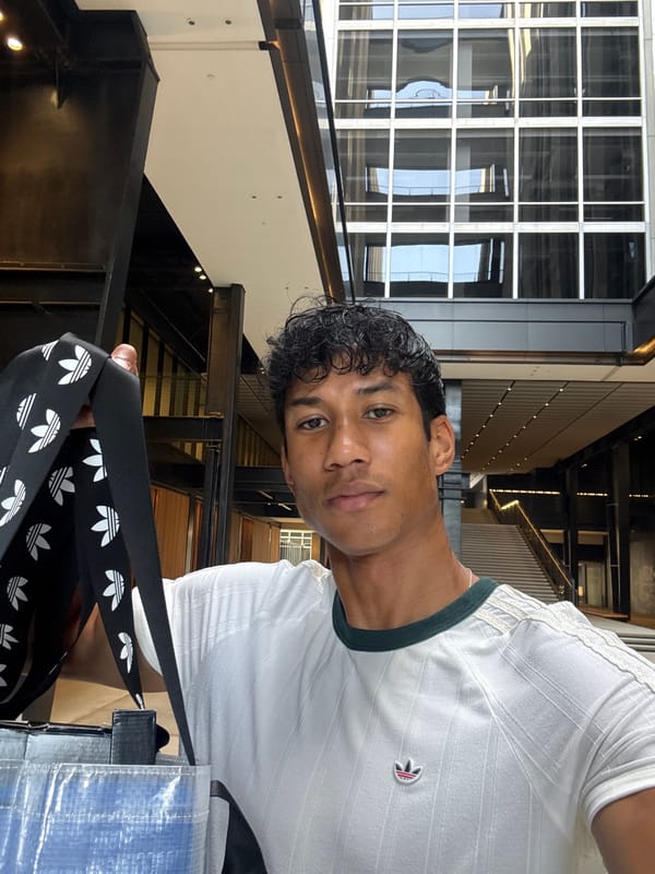 Young man with Adidas bags photographed in Los Angeles