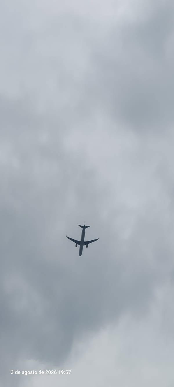 Cloudy summer afternoon at Castelldefels beach, planes overhead