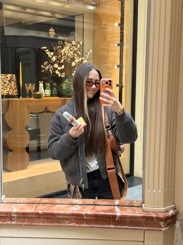 Woman takes selfie at Moscow store window display