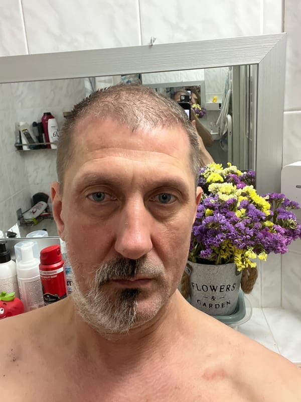 Charcoal mask day at home with an orange cat in Kyiv