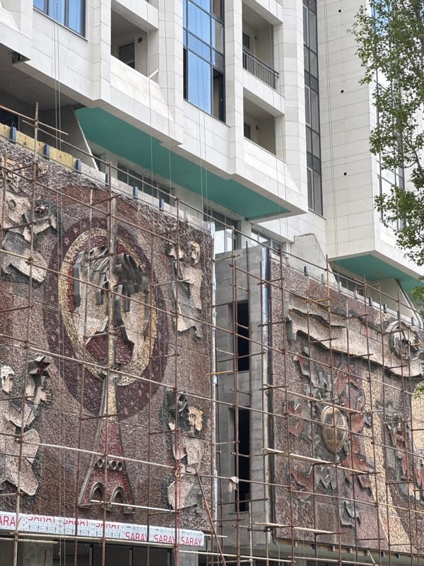 Building renovation features mosaic artwork on facade