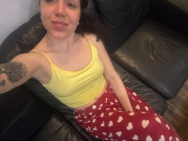 Woman rests on couch in Krasnovo, Bulgaria