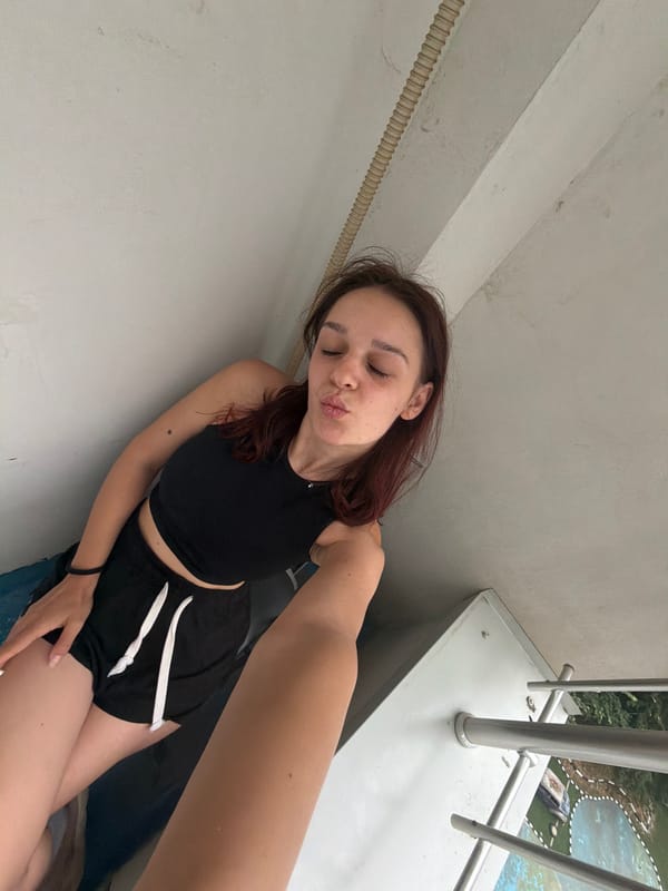 Quick selfie session on a Sofia balcony, summer afternoon.