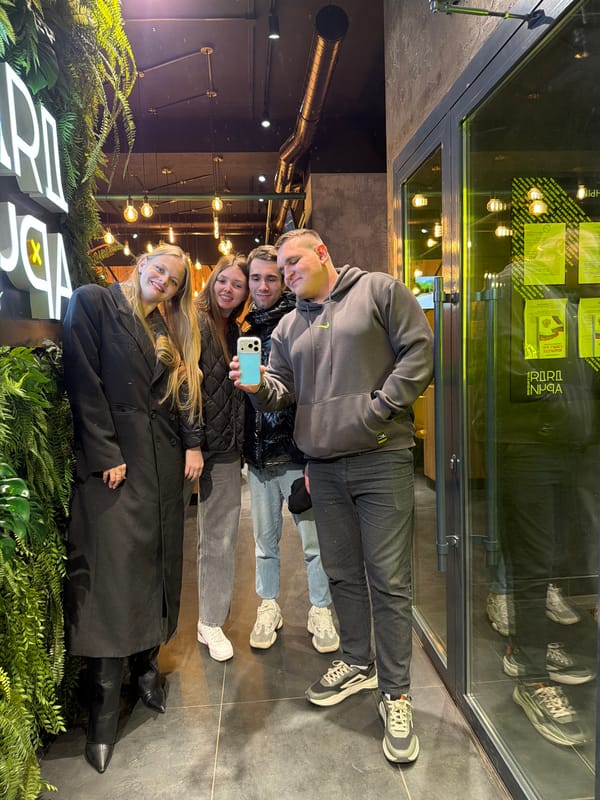 Group poses for selfie outside Izhevsk business