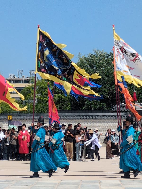 Traditional Korean procession with flags, drums draws crowds in Seoul