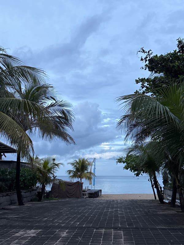 Overcast evening captured along Kuta's tranquil oceanfront walkways