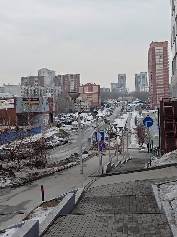 Urban scenes documented across Novosibirsk during overcast spring weather