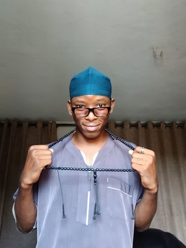 Man in traditional dress photographed repeatedly in Lagos home