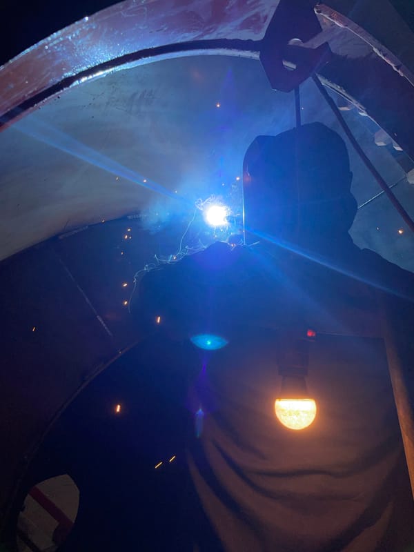 Early morning welding work inside cylindrical structure in Montenegro