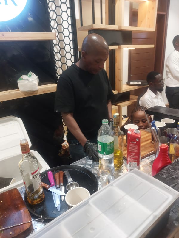 Bartenders serve drinks at makeshift bar in Dar es-Salaam