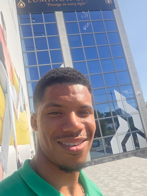 Selfie and parked van outside a glass building in Varna