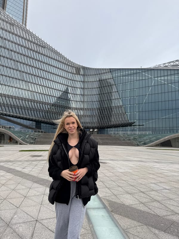 Casual shoot outside a curved glass building in Saint Petersburg