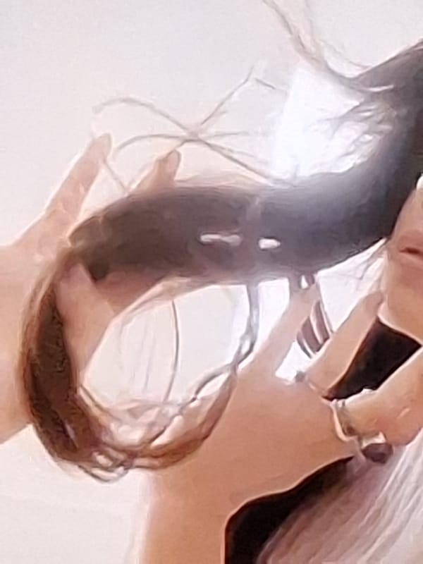 Person poses with hair in circular shape in Varna
