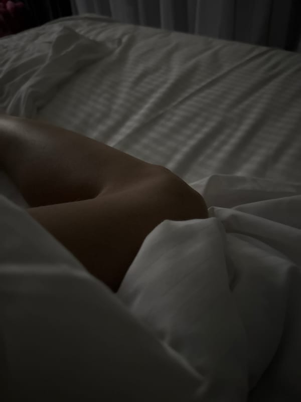 Quiet bedroom moments in a dimly lit Russian interior