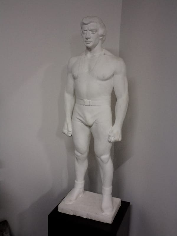 White muscular male statue observed indoors in Yerevan