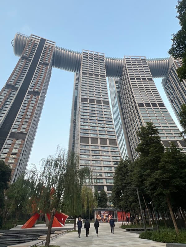 Tourists photograph at Chongqing landmarks during morning hours
