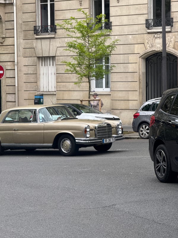 Woman spotted on Paris street near vintage Mercedes-Benz