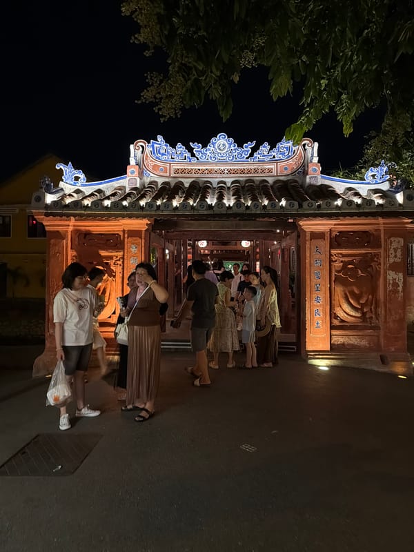 Hoi An old town at night — lanterns, live music, street life