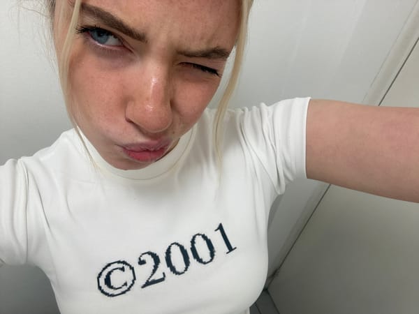 Woman in vintage 2001 shirt photographed in Manchester